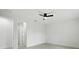 Bright bedroom featuring a ceiling fan and two doorways leading to other rooms at 4146 New Milford St, North Port, FL 34288