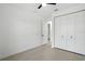 Bright bedroom with a ceiling fan, closet and a door leading to another room at 4146 New Milford St, North Port, FL 34288
