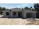 Close exterior shot of a new home with an attached garage surrounded by palm trees at 4146 New Milford St, North Port, FL 34288