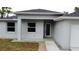 A close-up view of the home's front entrance, showcasing a covered porch and modern design at 4146 New Milford St, North Port, FL 34288