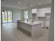 Bright, spacious kitchen with sleek countertops, modern appliances, and a large island perfect for entertaining at 4146 New Milford St, North Port, FL 34288