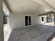 Spacious covered patio featuring tiled flooring, modern design, and ample natural light at 4146 New Milford St, North Port, FL 34288