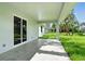Covered patio with tile floor offering backyard view and a great spot for outdoor relaxation at 4146 New Milford St, North Port, FL 34288