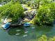 A waterfront home with a dock and kayaks floating in the adjacent canal at 5375 Circle Dr, Weeki Wachee, FL 34607
