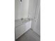 Bathroom featuring a stylish vanity with white cabinets and a modern countertop at 4098 New Milford St, North Port, FL 34288