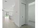 Hallway entrance leading to the open kitchen and living area at 4098 New Milford St, North Port, FL 34288