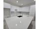 Bright kitchen featuring an oversized island with seating and modern fixtures at 4098 New Milford St, North Port, FL 34288