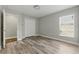 Bedroom with laminate floors, closet, bright window and side shelves at 19713 Ellendale Dr, Land O Lakes, FL 34638