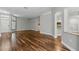 Bright open-concept living room with hardwood floors and neutral walls at 19713 Ellendale Dr, Land O Lakes, FL 34638