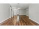 Open-concept living room featuring hardwood floors and lots of natural light at 19713 Ellendale Dr, Land O Lakes, FL 34638