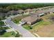 An aerial shot of a home, revealing its curb appeal, professional landscaping, and the tranquil neighborhood it resides within at 13475 Crest Lake Dr, Hudson, FL 34669