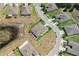 An aerial view of a home showcasing the surrounding neighborhood with meticulously planned streets and green spaces at 13475 Crest Lake Dr, Hudson, FL 34669