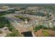 A high aerial shot of a property located in a residential area with serene ponds offering a peaceful living environment at 13475 Crest Lake Dr, Hudson, FL 34669