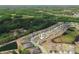 A community view with pool, ponds and neighborhood landscape creating a desirable living environment surrounded by mature trees at 13475 Crest Lake Dr, Hudson, FL 34669