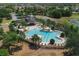 A luxurious community pool area, perfect for relaxation and recreation in a beautiful setting with lush landscaping at 13475 Crest Lake Dr, Hudson, FL 34669