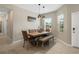 Cozy dining area with modern lighting and plenty of natural light at 13475 Crest Lake Dr, Hudson, FL 34669