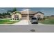 Charming single-story home featuring a well-manicured lawn, attached garage, and a welcoming facade at 13475 Crest Lake Dr, Hudson, FL 34669