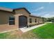 Exterior view of the home with a screened porch, manicured lawn, and tidy landscaping at 13475 Crest Lake Dr, Hudson, FL 34669