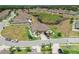 Well-manicured front exterior featuring a driveway and landscaping, reflecting pride of ownership in a Gathering-friendly neighborhood at 13475 Crest Lake Dr, Hudson, FL 34669