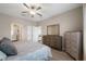 Well-lit bedroom features neutral walls and wood-look flooring at 13475 Crest Lake Dr, Hudson, FL 34669