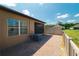 Paver patio with screened lanai and privacy fence, perfect for enjoying the outdoors at 13475 Crest Lake Dr, Hudson, FL 34669