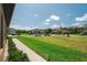 Street view of the home with well-manicured lawns and landscaped frontage at 13475 Crest Lake Dr, Hudson, FL 34669