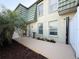 Beautiful back patio with an outdoor shower, mature landscaping and direct entry to unit at 1799 N Highland Ave # 143, Clearwater, FL 33755