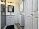 Bathroom boasting a vanity, walk in shower, modern fixtures and stylish design at 1799 N Highland Ave # 143, Clearwater, FL 33755