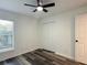 Bedroom featuring a ceiling fan, closet, window with blinds, and modern vinyl plank flooring at 1799 N Highland Ave # 143, Clearwater, FL 33755