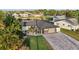 Aerial view of the renovated home and lush surroundings, located on the water with private boat dock at 5036 Bonito Dr, New Port Richey, FL 34652
