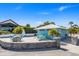 Gulf Highlands Beach Club patio seating area with tables, chairs, BBQ grill, and snack bar area at 5036 Bonito Dr, New Port Richey, FL 34652