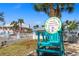 A sign reads 'Private Beach Club Members Only' near a quaint turquoise seating arrangement at 5036 Bonito Dr, New Port Richey, FL 34652