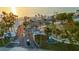 A panoramic view of a sandy beach with palm trees, picnic pavilions, and beach access at 5036 Bonito Dr, New Port Richey, FL 34652