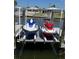 View of the boat lift and personal watercraft at this waterfront property at 5036 Bonito Dr, New Port Richey, FL 34652
