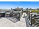 Waterfront boat dock with boat lift, and black metal railing at 5036 Bonito Dr, New Port Richey, FL 34652