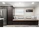 Stylish kitchen nook featuring a built-in bench and stainless steel appliances at 5036 Bonito Dr, New Port Richey, FL 34652