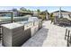 Luxurious outdoor kitchen with a built-in grill and dining area, ideal for entertaining at 5036 Bonito Dr, New Port Richey, FL 34652