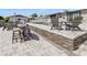 Relaxing outdoor patio with comfortable seating and elegant stonework, great for entertaining at 5036 Bonito Dr, New Port Richey, FL 34652