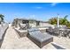 Beautifully designed patio area with comfortable seating and a view of the backyard oasis at 5036 Bonito Dr, New Port Richey, FL 34652