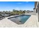 Inviting pool area with modern pavers, outdoor seating, and a serene waterfront view for relaxation at 5036 Bonito Dr, New Port Richey, FL 34652