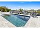 Gorgeous pool with waterfront access, lounge chairs, and space for outdoor entertaining in a backyard oasis at 5036 Bonito Dr, New Port Richey, FL 34652