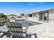 Tranquil pool setting with comfortable seating, lush landscaping, and a perfect spot for outdoor relaxation at 5036 Bonito Dr, New Port Richey, FL 34652