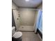 Bright bathroom featuring a stand-up shower with white subway tile and a decorative shower floor at 8702 El Portal Dr, Tampa, FL 33604