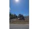 Construction site view on sunny day with heavy machinery and freshly moved earth at 487 Sunset N Rd, Rotonda West, FL 33947