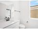 Modern bathroom featuring a white vanity, black hardware, and glass shower at 6018 Jensen View Ave, Apollo Beach, FL 33572