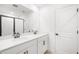Modern bathroom featuring double sink vanity, large mirror, and a glass-enclosed shower at 6018 Jensen View Ave, Apollo Beach, FL 33572
