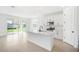 Open kitchen with a center island, white cabinets, and stainless steel appliances at 6018 Jensen View Ave, Apollo Beach, FL 33572
