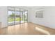 View to backyard with a covered patio visible through sliding glass doors at 6026 Jensen View Ave, Apollo Beach, FL 33572