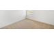 Bedroom with neutral carpeting and a window providing natural light at 6026 Jensen View Ave, Apollo Beach, FL 33572