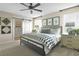 Calm bedroom featuring neutral colors, geometric decor, and a sliding barn door at 6026 Jensen View Ave, Apollo Beach, FL 33572